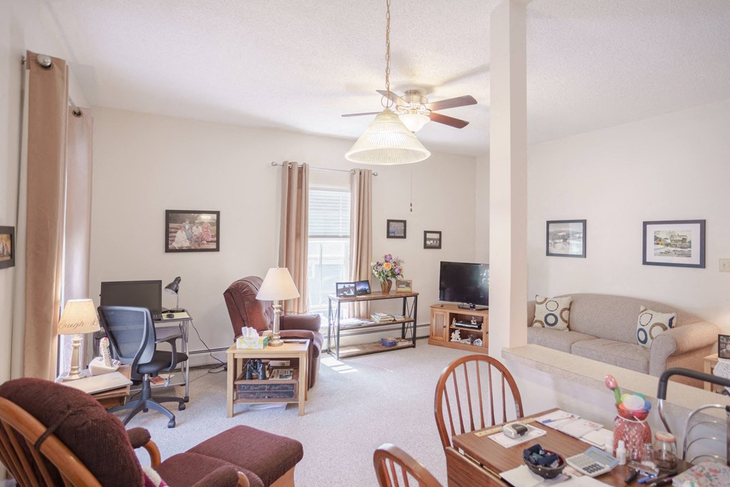 a living room with a couch and a tv