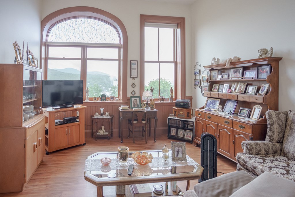 a living room filled with furniture and a tv