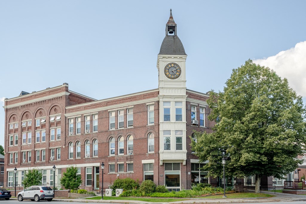 a large brick building with a clock tower