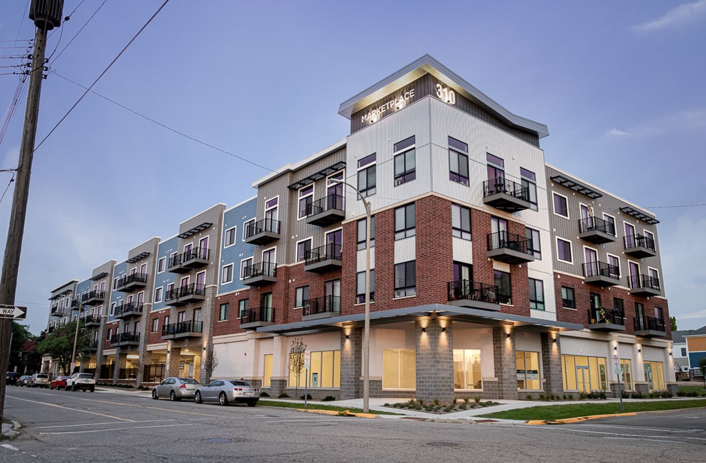 an apartment building on the corner of a street