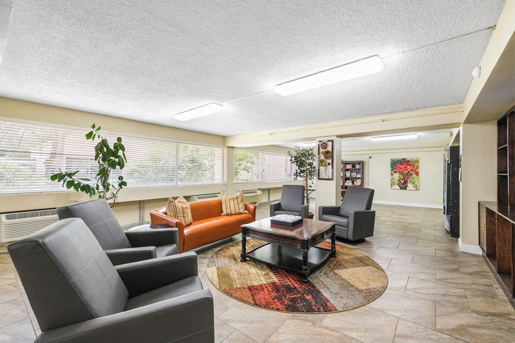 a lobby with couches and chairs and a coffee table