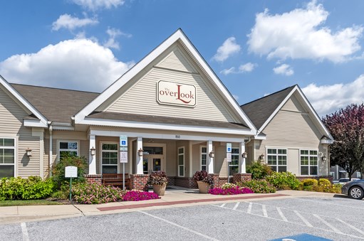 the front of our hotel building with our sign