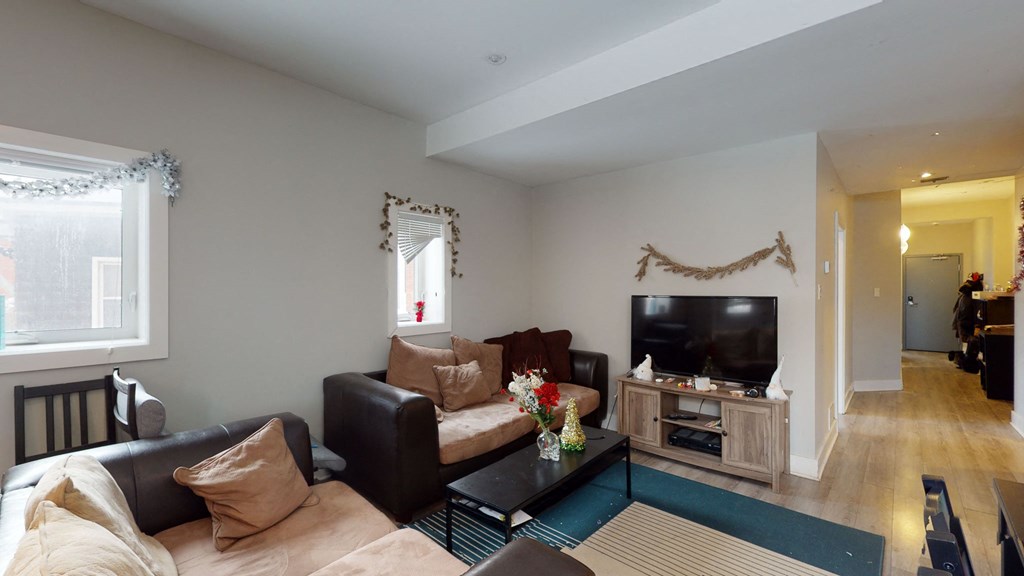 a living room with a couch and a tv