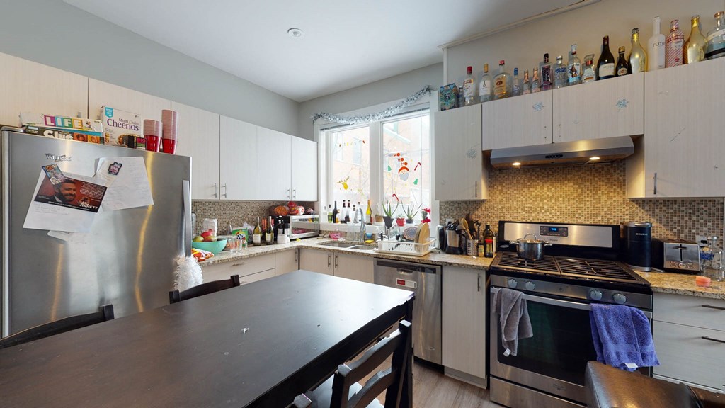 a kitchen with a counter and a refrigerator