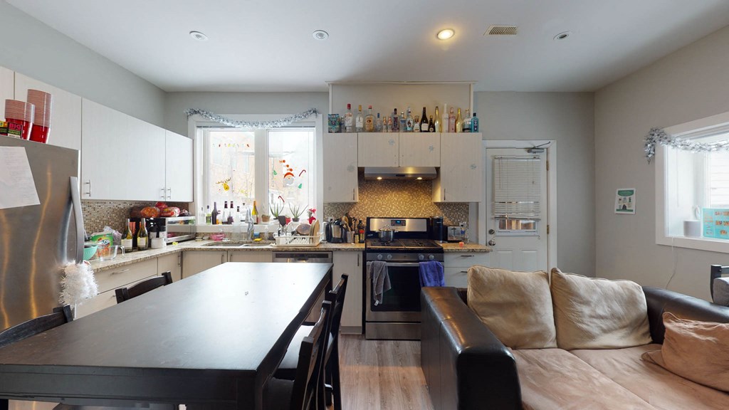 a kitchen with a counter and a table