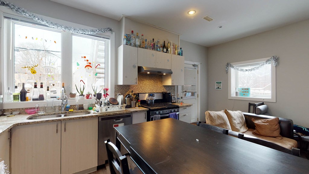 a kitchen and dining room with a table