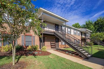 beautiful apartment exterior with lush landscaping at The Mills at 601, Prattville, 36066