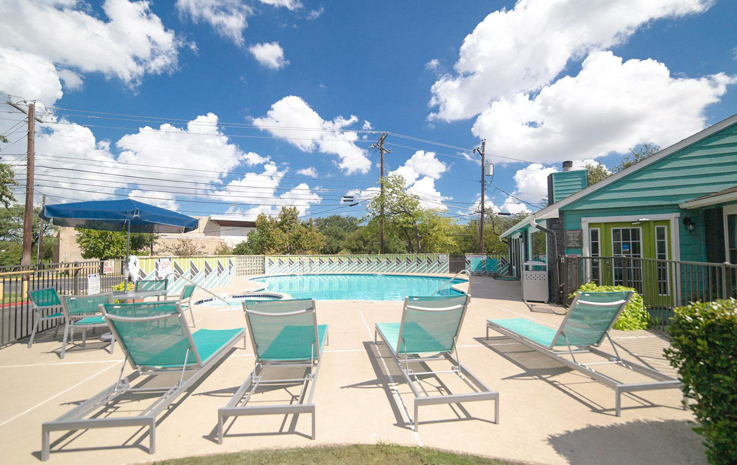 lounge chairs surrounding pool