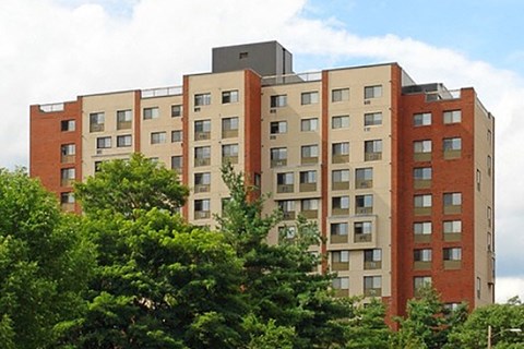 a large building with trees in front of it