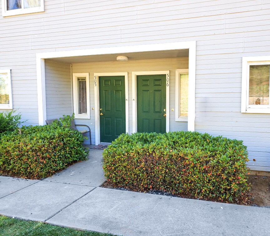 Exterior view of front door at Cameron Park Village Apartments, California