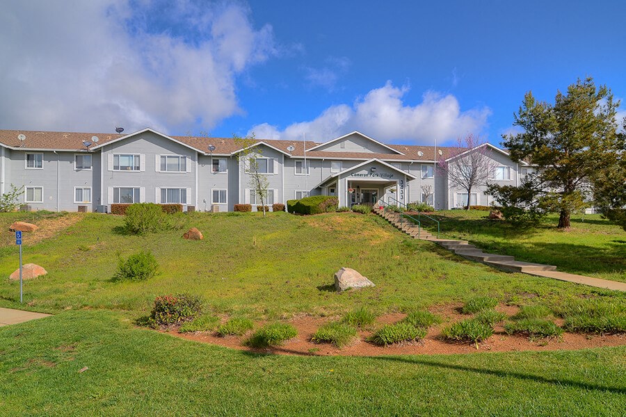 Exterior view of property and buildings at Cameron Park Village Apartments, Cameron Park, CA