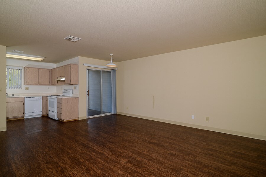 Living room with patio door at Cameron Park Village Apartments, Cameron Park, California