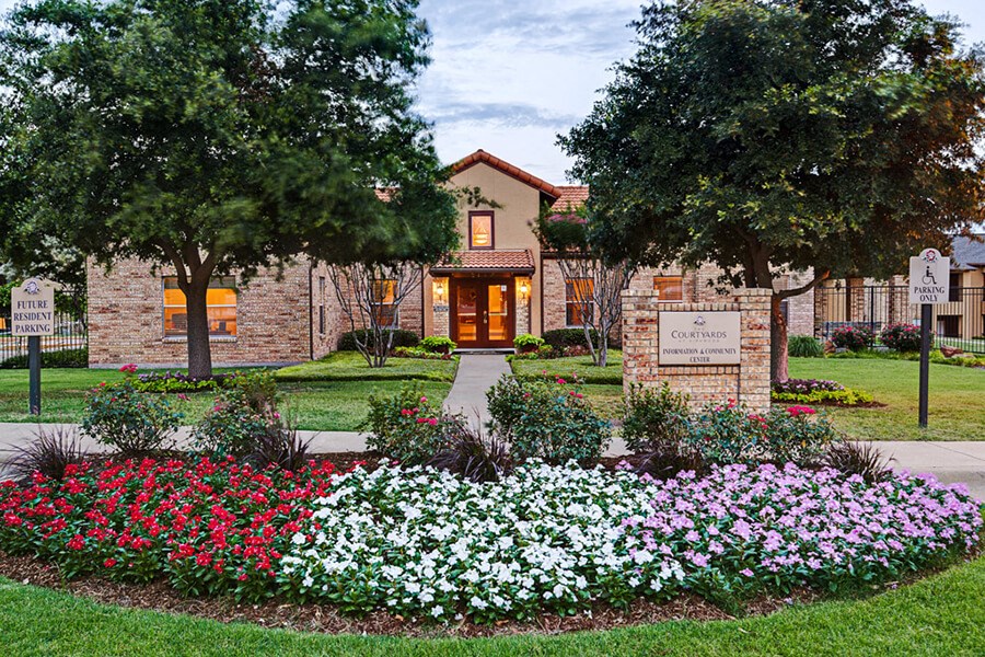 Exterior view  of leasing office with monument sign