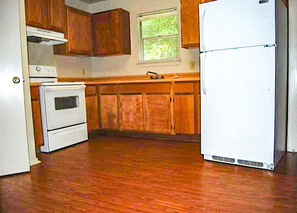 a kitchen with a stove and a refrigerator