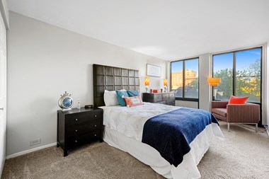 Bedroom with bed, night stand city view at 7251 at Waters Edge, Chicago - Photo Gallery 2
