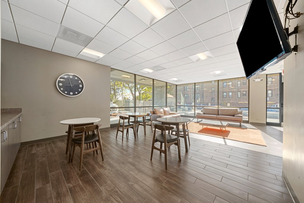 Leasing office with couches and tables with chairs at 7251 at Waters Edge, Illinois, 60649
