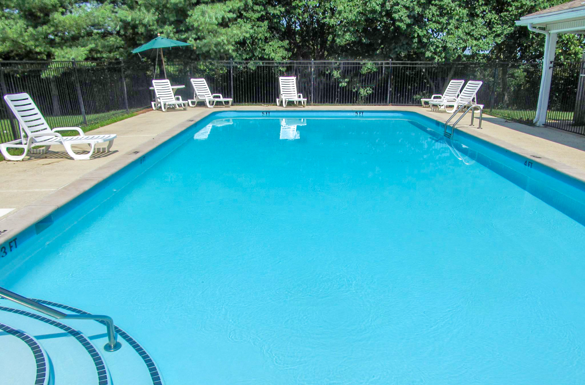 Pool with lounge chairs at Cobblestone Corners Apartment Homes, Nashville, 37216