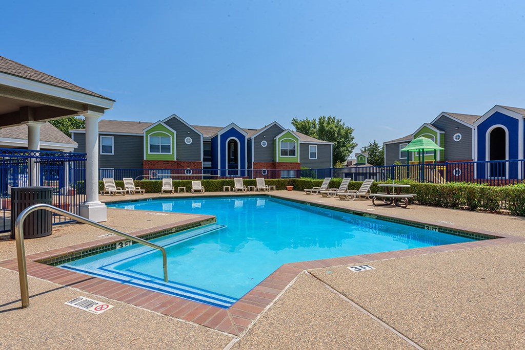 Pool surrounded by lounge chairs