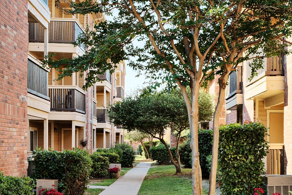 Exterior of building and sidewalk to apartments