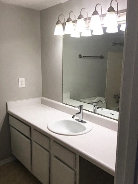 Bathroom sink and mirror at Landmark Apartment Homes, Meridian, Mississippi