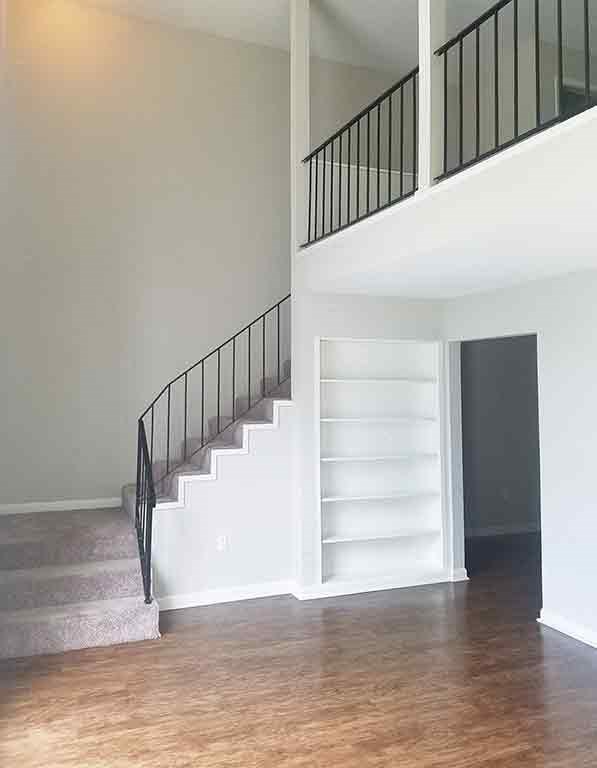 Stairs leading to lofted bedroom at Stratford Manor Apartment Homes, Meridian, 39305