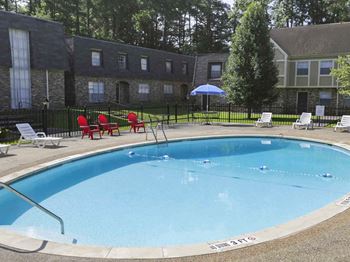 Pool With Sunning Deck at Stratford Manor Apartment Homes, Meridian, Mississippi