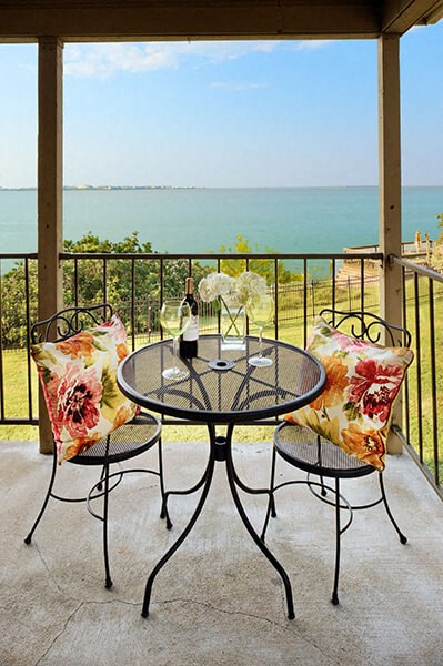 Patio with table and two chairs at Sugar Tree Apartment Homes, Corpus Christi, Texas