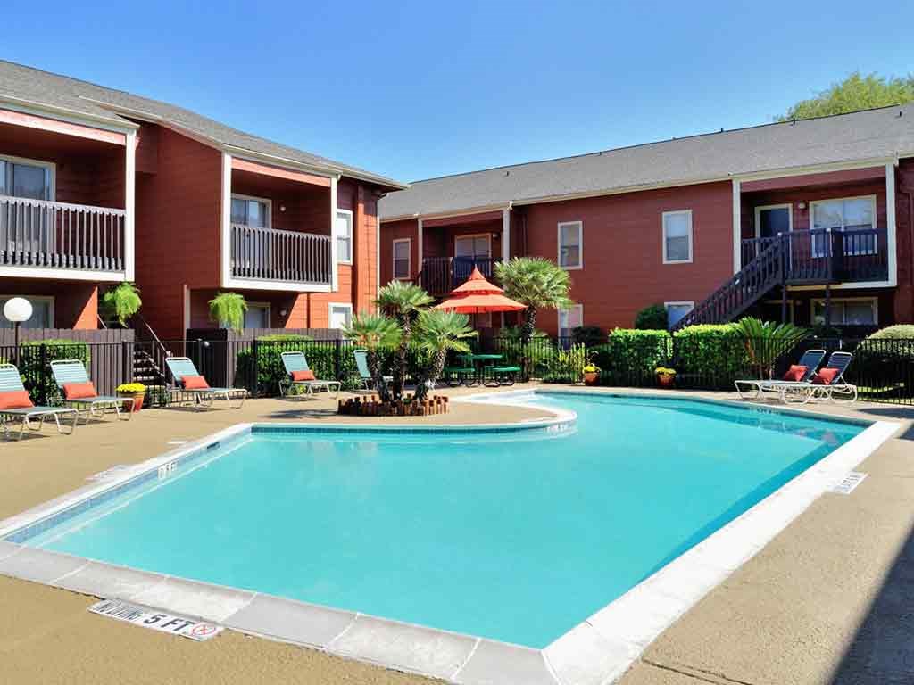 Pool surrounded by lounge chairs