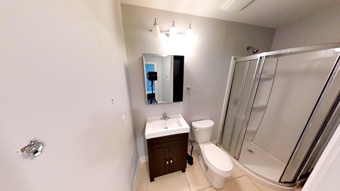 a bathroom with a sink toilet and a shower