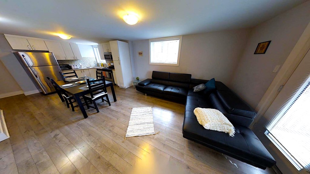 an overview of a living room with a couch and a table