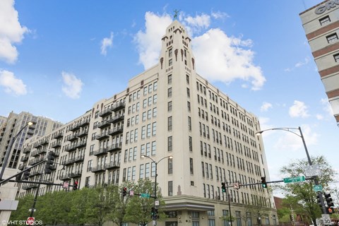 A tall building with a clock tower on the top.