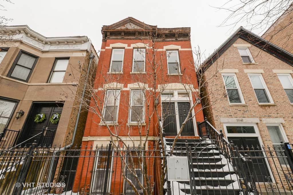 a red brick building with scaffolding in front of it
