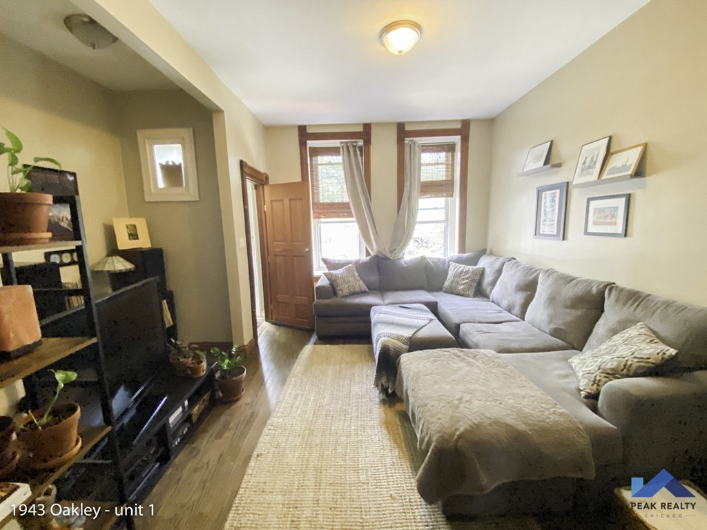 a living room with a couch and a tv