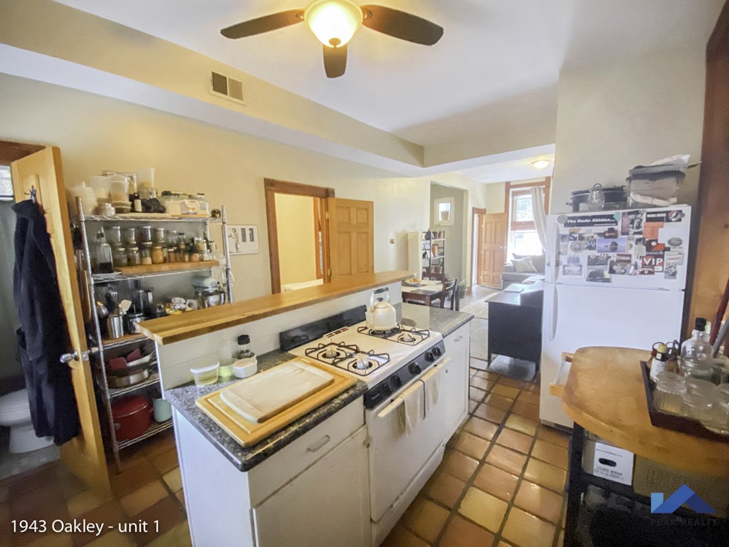 a kitchen with a stove and a refrigerator