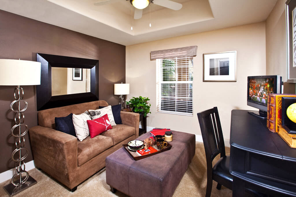 a living room with a couch and a tv