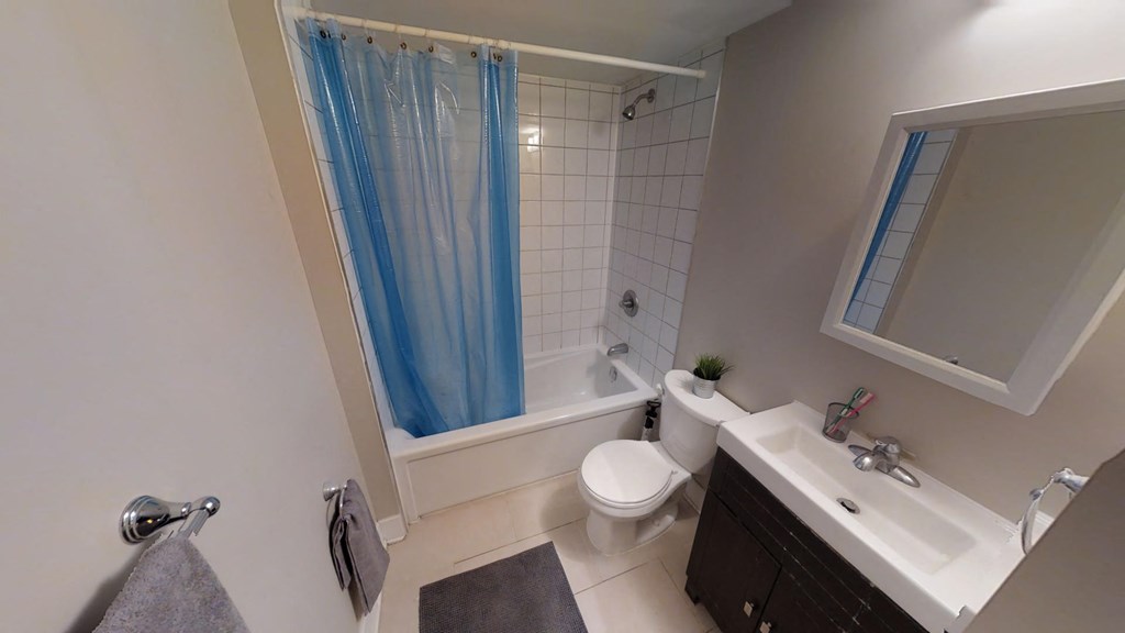 a bathroom with a sink toilet and a tub