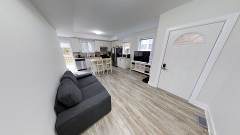 a living room with a couch and a tv