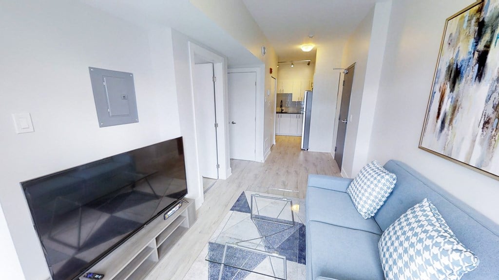 a living room with a couch and a tv