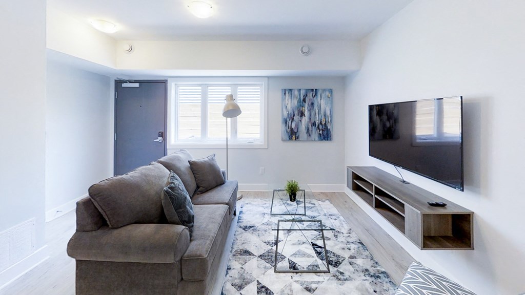 a living room with a couch and a tv