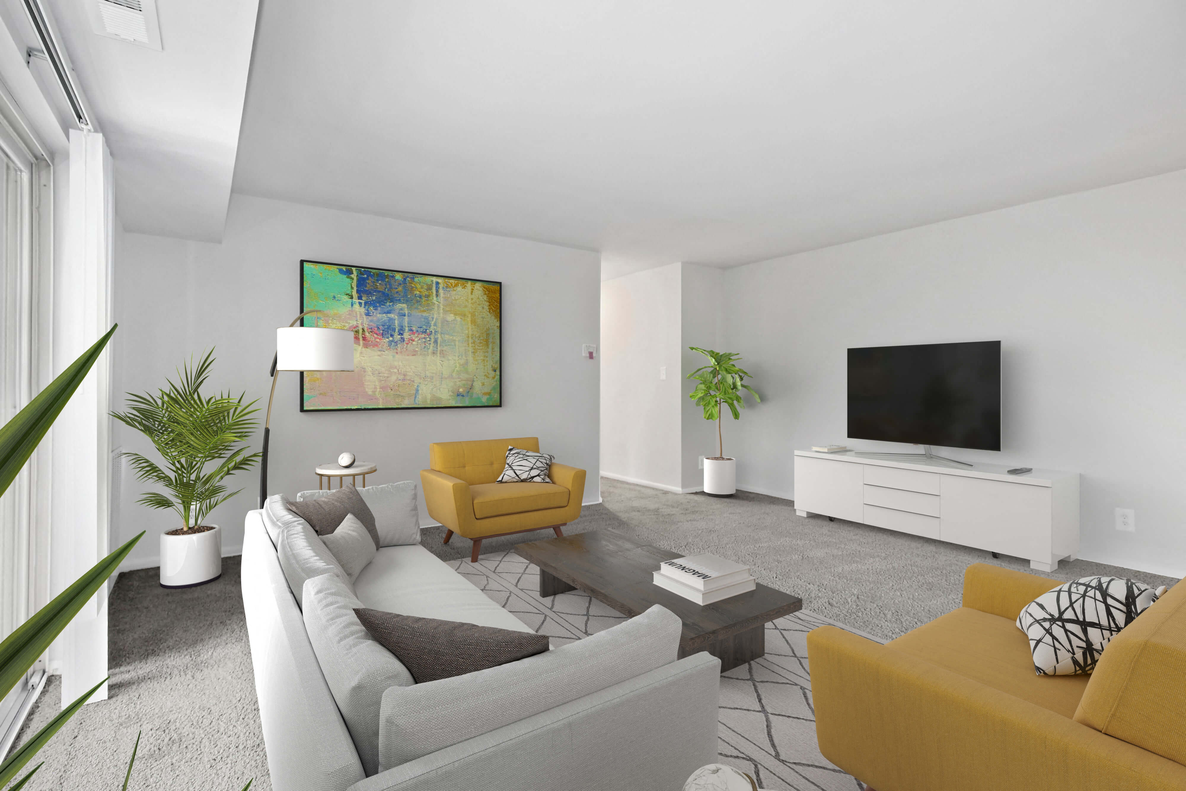 a living room with couches and a tv