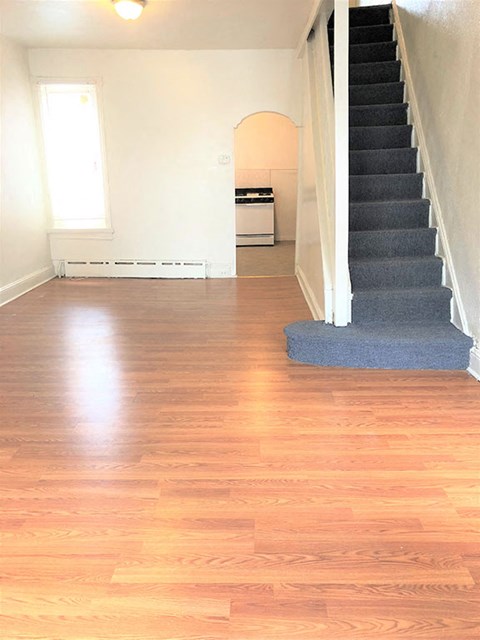 A room with a staircase and a window.