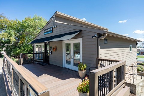 A small building with a porch and a sign that says "Blue Star Ferries".