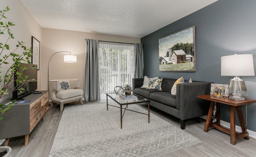 a living room with a couch and a table