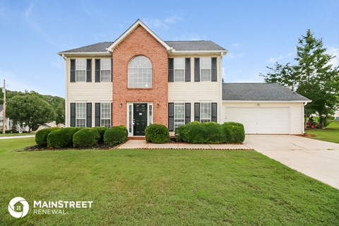 a house with a lawn in front of it