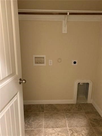 a bathroom with a door open to a hallway