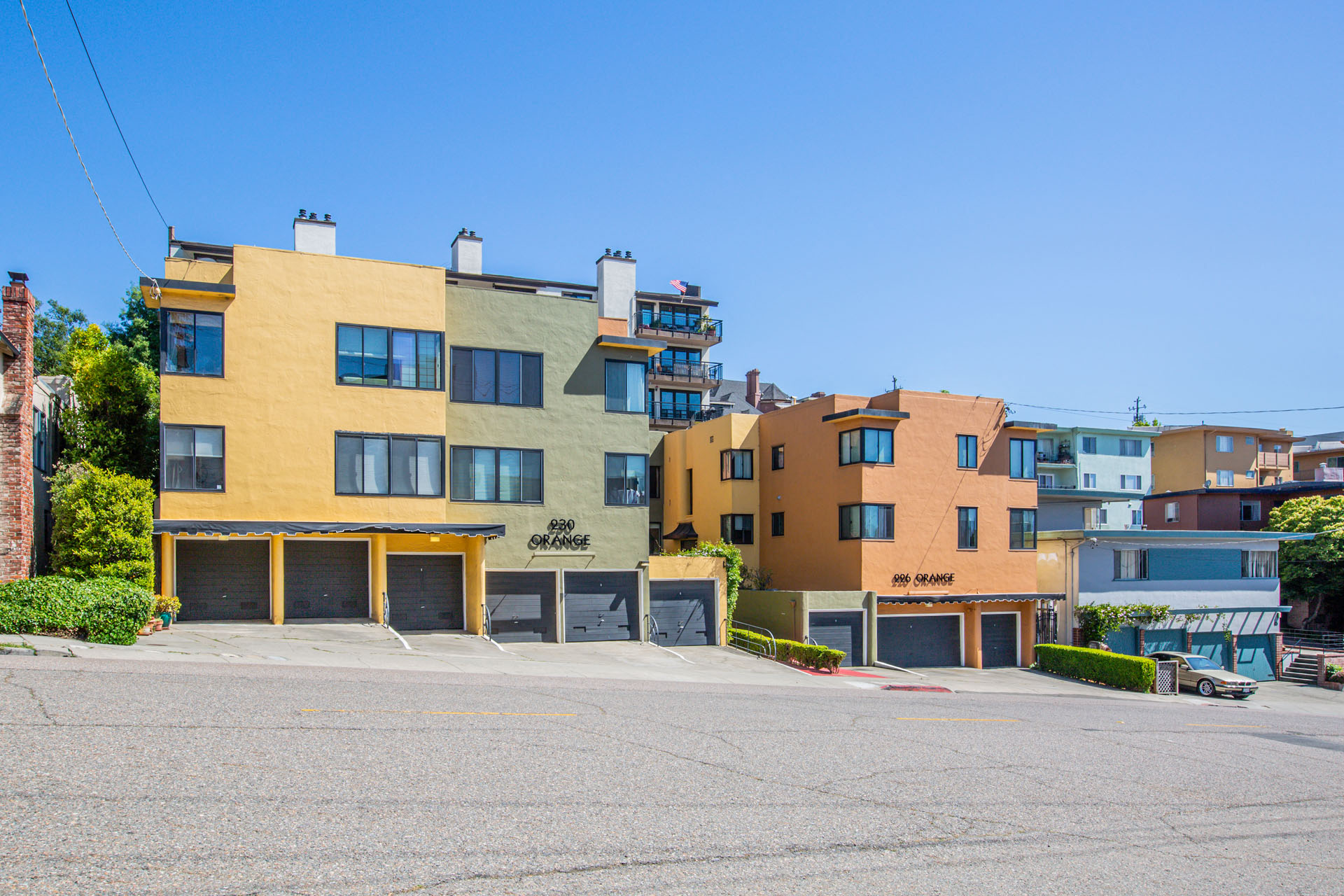 A row of colorful buildings with the number 900 on the yellow one.