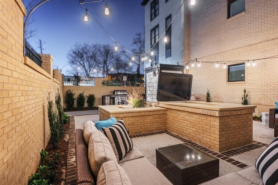 a backyard with a tv and a couch