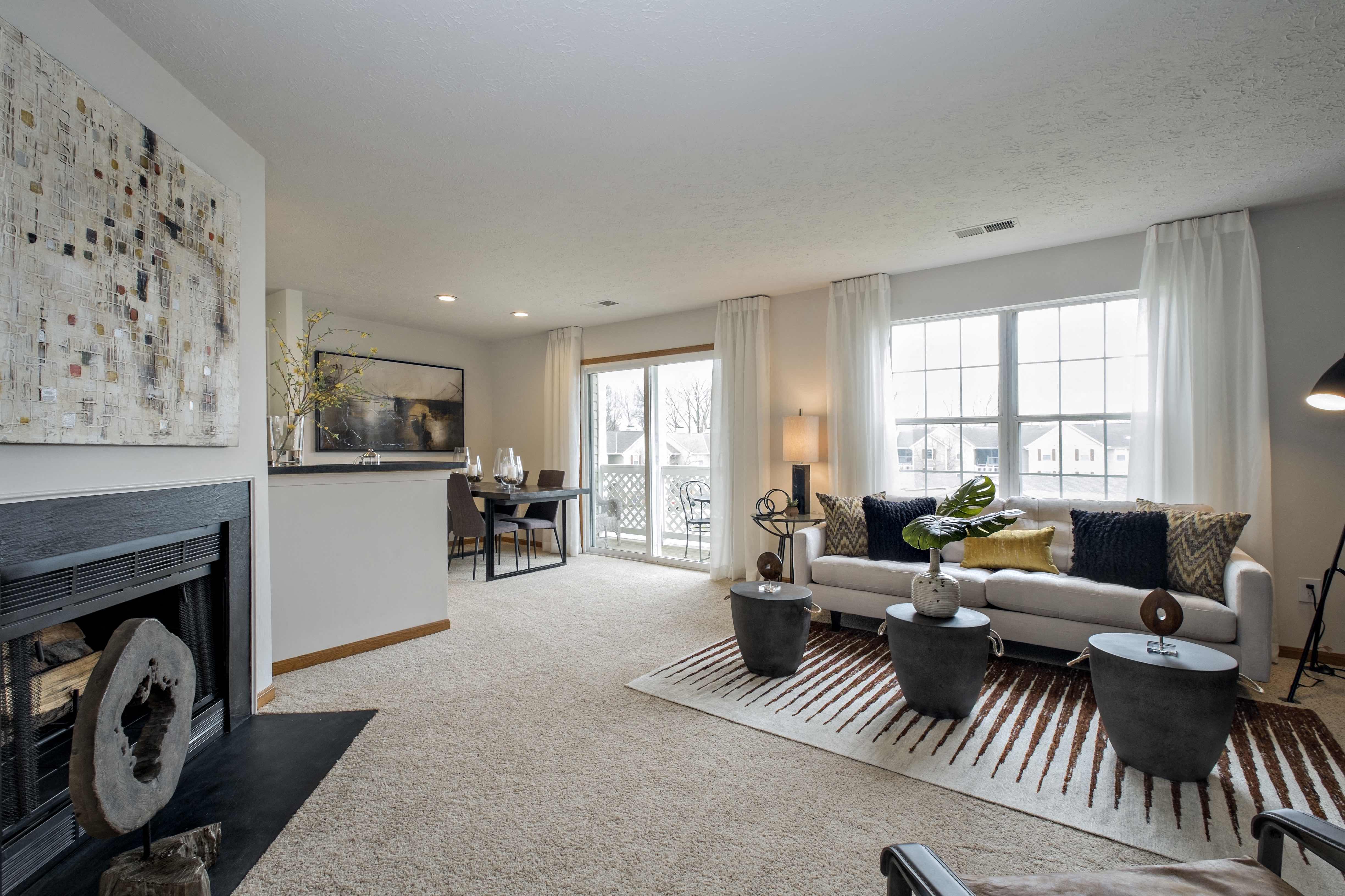 a living room with a fireplace and a couch