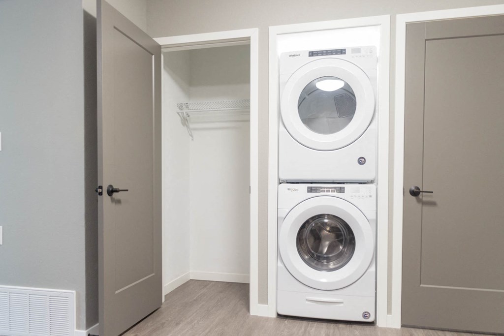 a front loading washer and dryer in a closet