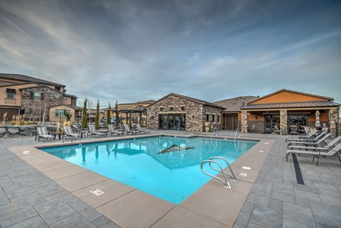 our resort style swimming pool is located next to our clubhouse and is filled with chairs